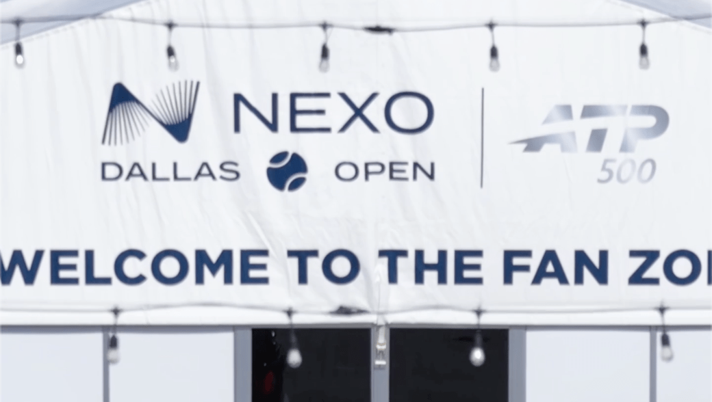 Blue words on a white tent reading Welcome to the NEXO Dallas Open